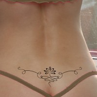 Lotus lower back tattoo photo