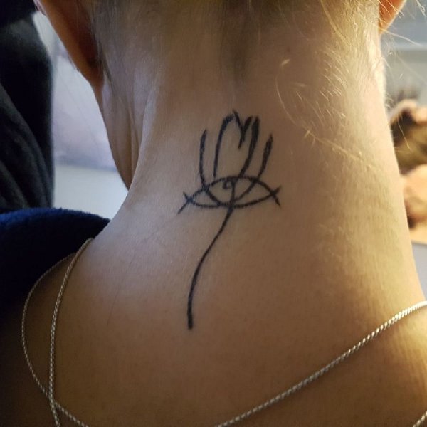 Barbara - Minimal lotus tattoo photo