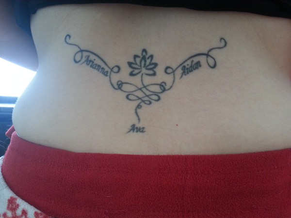 Dionne - lotus lowerback tattoo