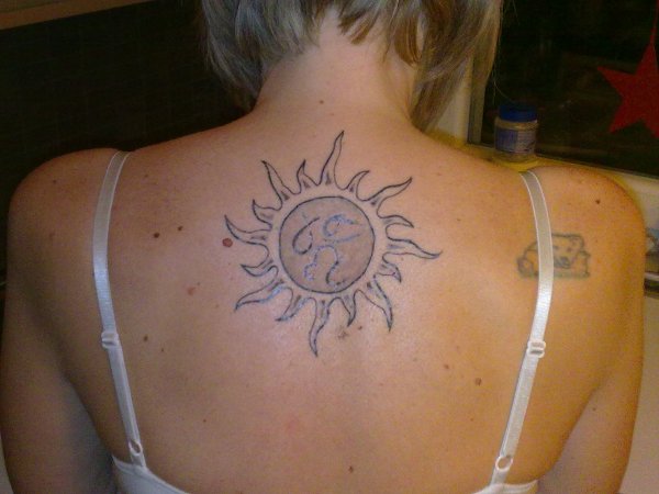 Evil Zone - Sun and zodiac signs tattoo