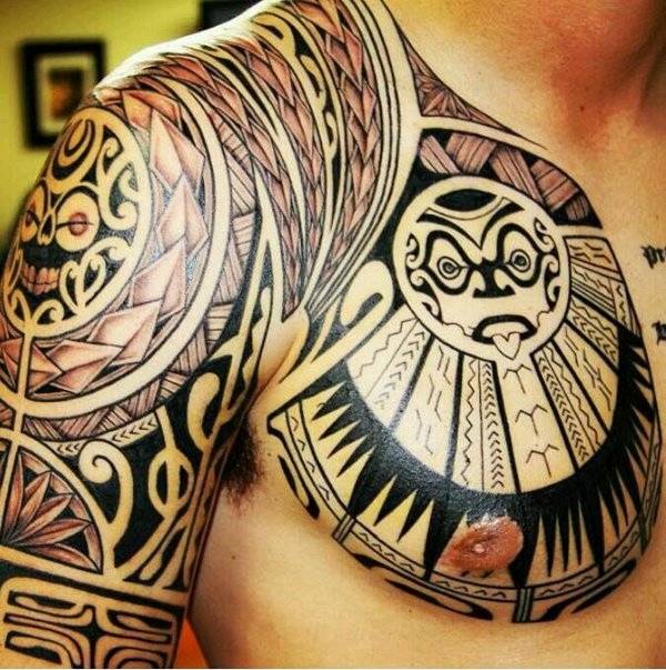 Guest - Polynesian chest and arm tattoo