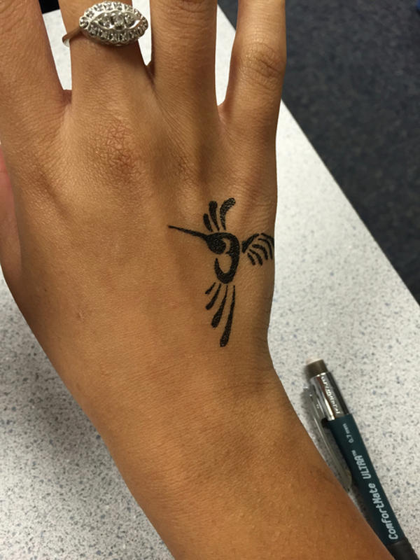 Janelle - hummingbird tattoo