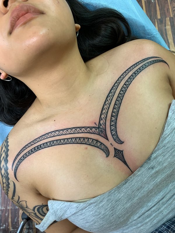 Lio - breast piece tattoo