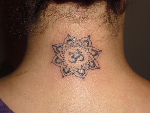 Pamela - Lotus and Aum tattoo