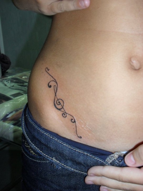 Rosanna - Treble clef swirls tattoo