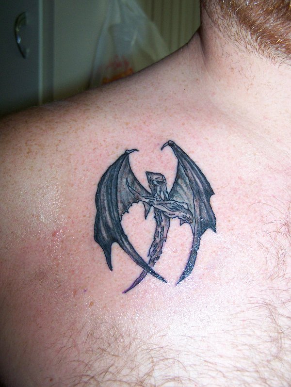 Shawn - Wooden winged cross tattoo photo