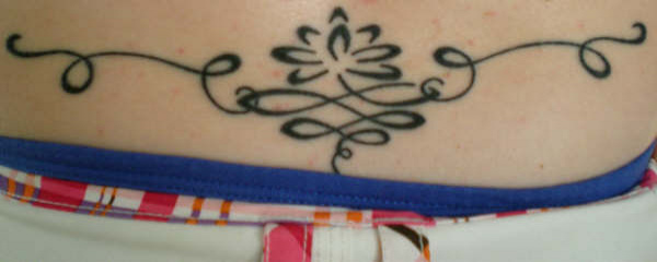 Tina - Lotus lower back tattoo